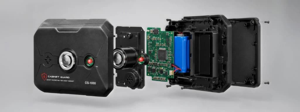 Exploded view of the Cabinet Guard CG-1000 showing casing, circuitry, and battery